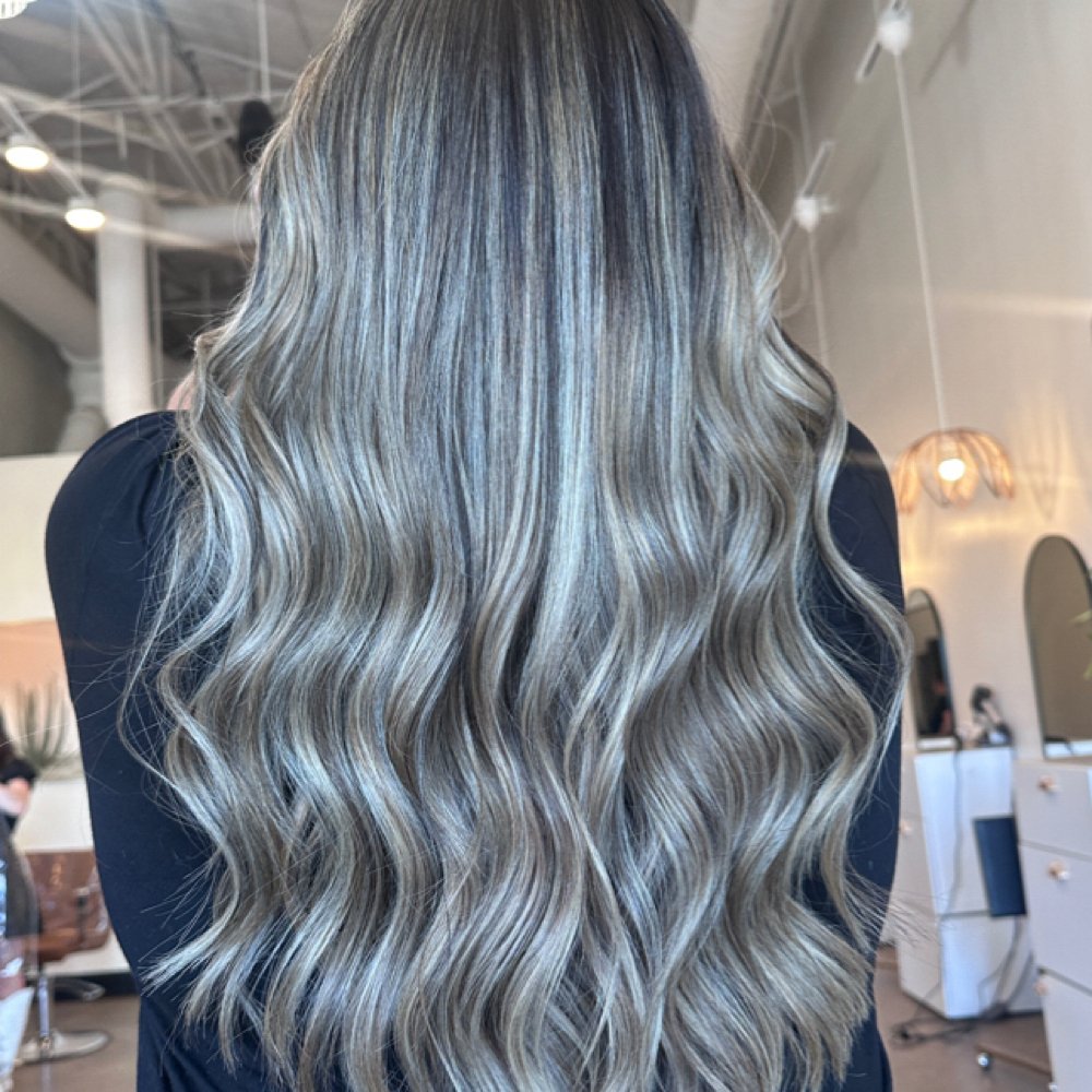 Cool blonde highlights flowing through long waves